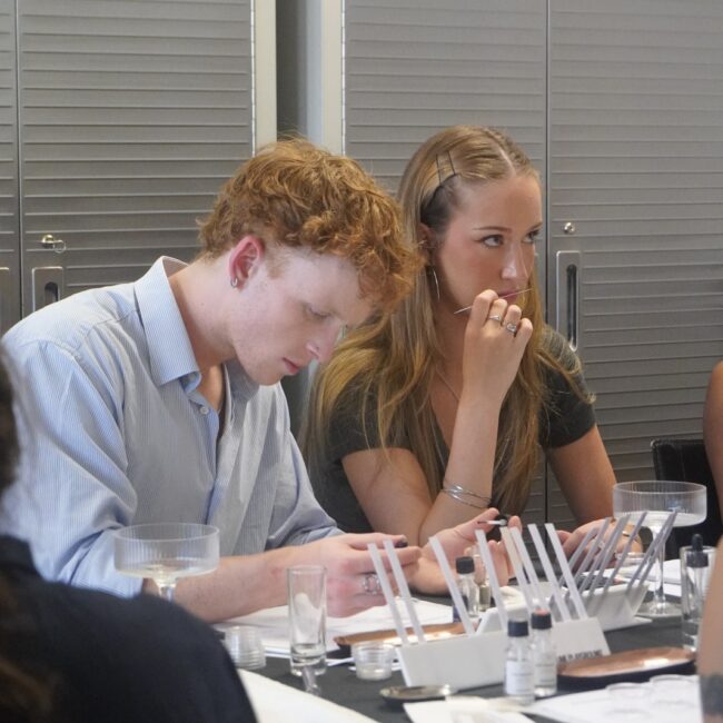 Two participants comparing scents while creating their own perfumes.